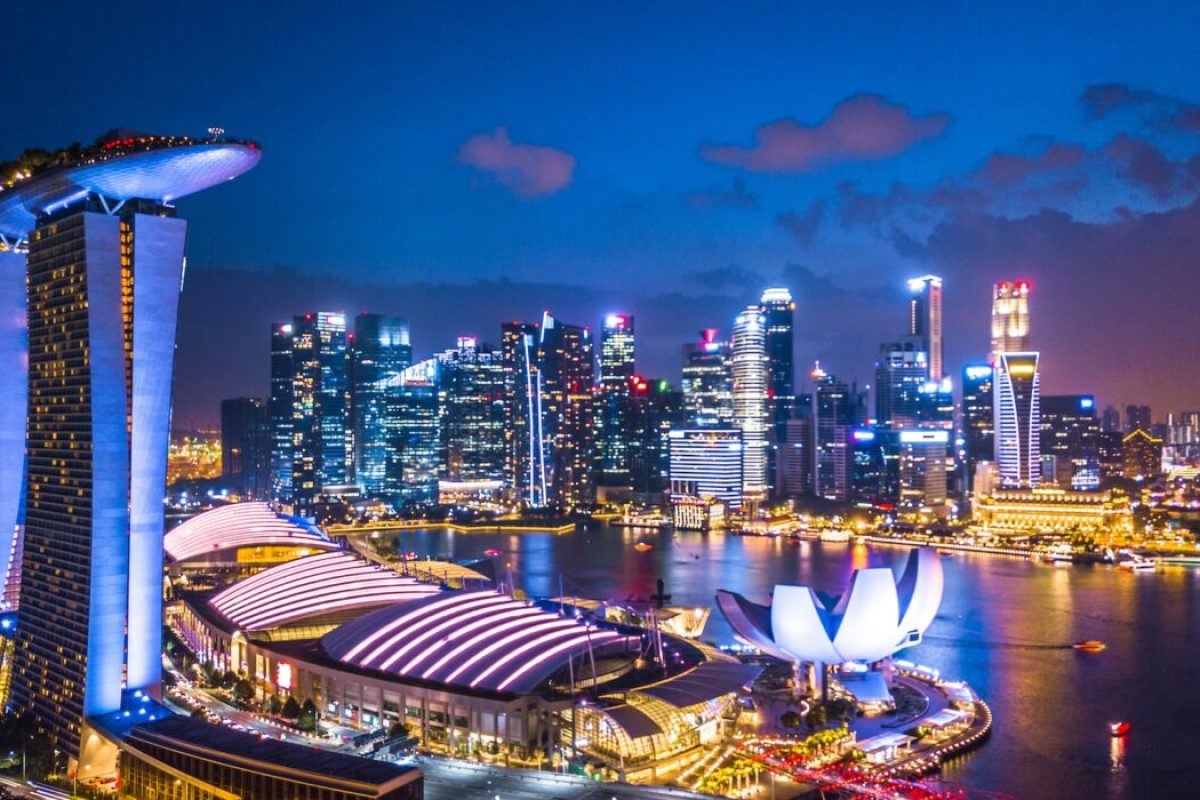 Aerial view Singapore city landscape skyline and skyscraper at night, Singapore architecture business building around Marina bay at night all hotel and financial business office bank light up.